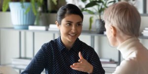 Two business lady talking to each other