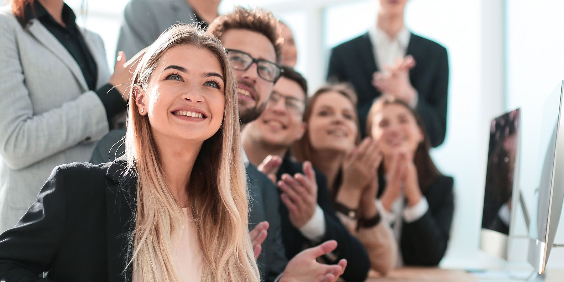 happy business people clapping