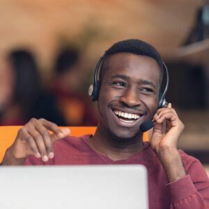 Man talking on headset happily