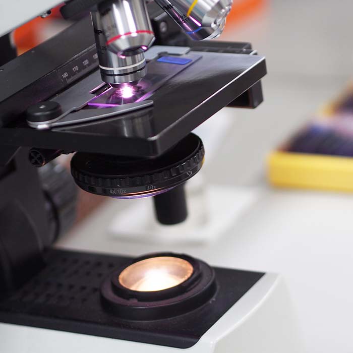 A microscope on a lab desk
