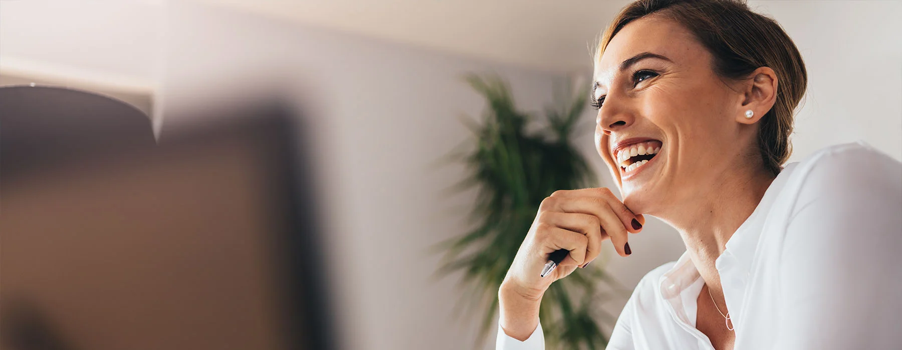 Happy formally dress lady smiling at people