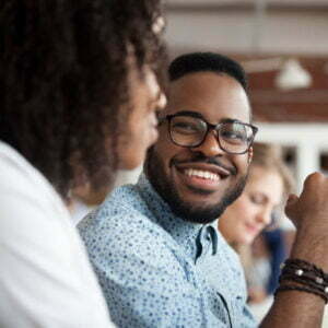 Man smiling at woman