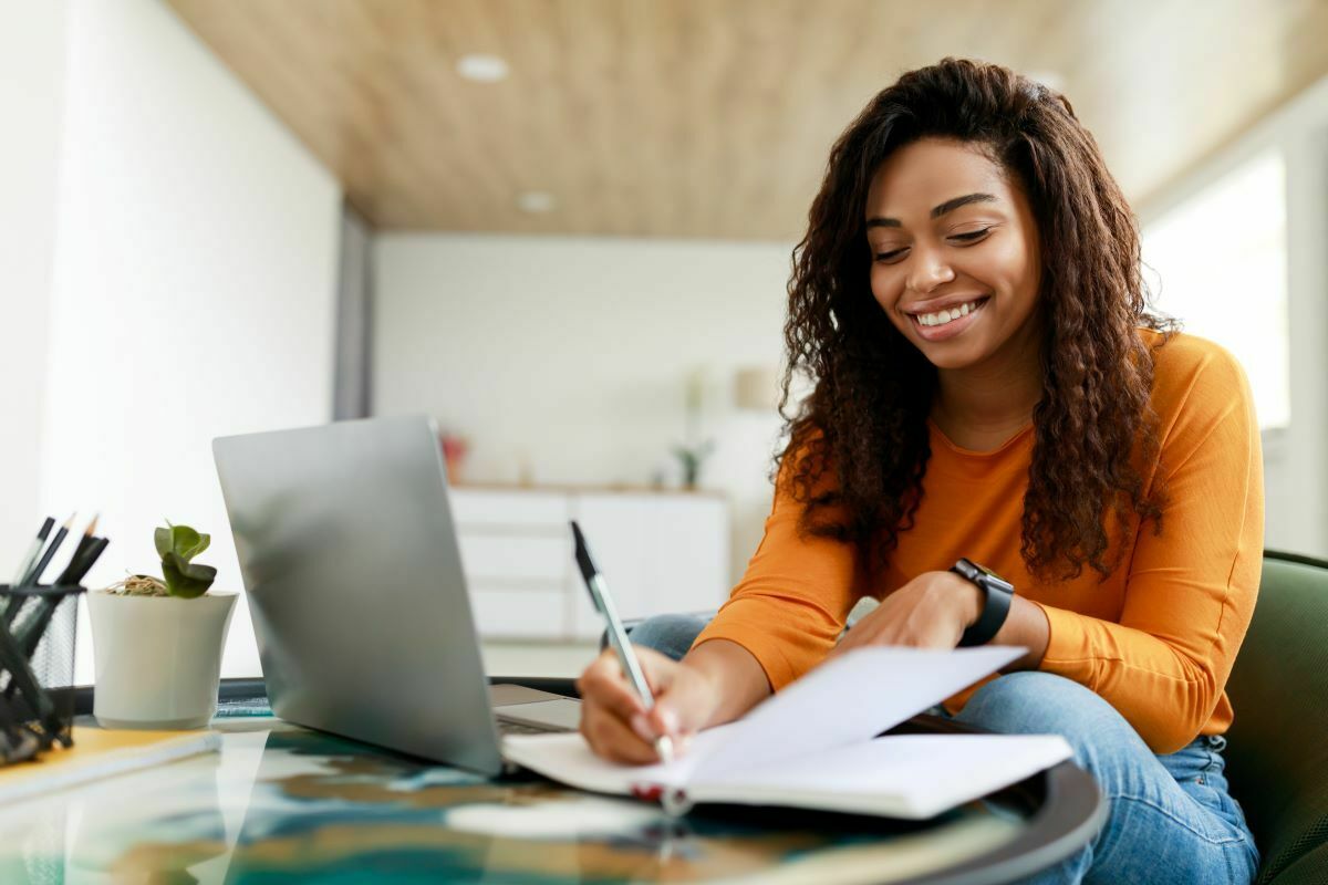 Member taking notes during webinar