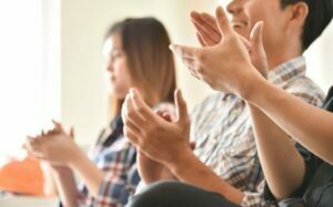 members clapping for Cooperative money distributions