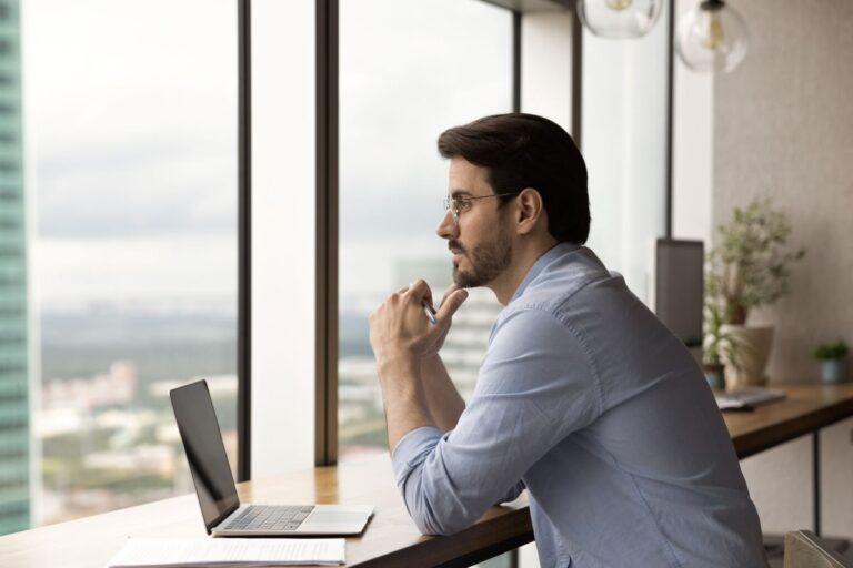 Business man pondering the future