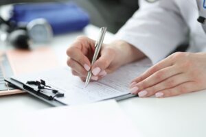 Medical professional reviewing prior authorization